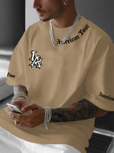 Laden Sie das Bild in den Galerie-Viewer, TRENDY BAGGY LA T-SHIRT - BARBER TRENDS WORLD