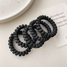 Laden Sie das Bild in den Galerie-Viewer, SPIRAL-HAARGUMMI MATT SCHWARZ – CLEANER LOOK, MAXIMALER HALT - BARBER TRENDS WORLD